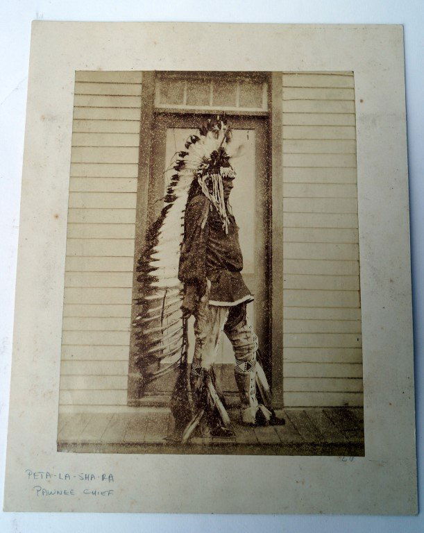 W.H. Jackson Photo Pawnee Chief: William Henry Jackson photograph, a Pawnee chief , Peta-La-Sha-Ra, poses in full regalia beside Jackson' s studio in Omaha. 8 7/8" x 6 3/4"