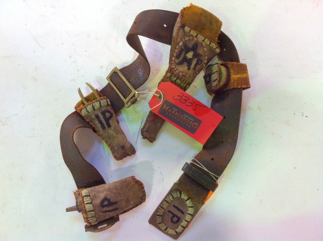 Indian Police Belt: With brass powder horn with eagle. A brass bullet mold; a Hicks Percussion caps tin box, Central Fire with some inside . Beadwork IP on the holders. 36"L.