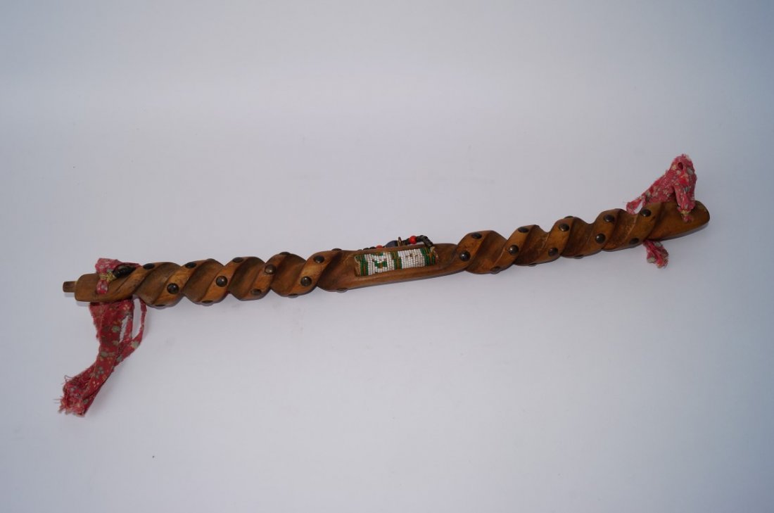 American Indian Mystery Pipe: With beadwork and brass studs. May be missing bowl. 24" L.
