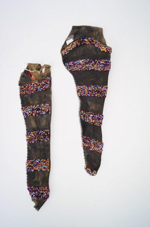 Apache Holster and Knife Sheath: Corn beaded coup lines are a very early style. The holster fits an 1860 colt.
