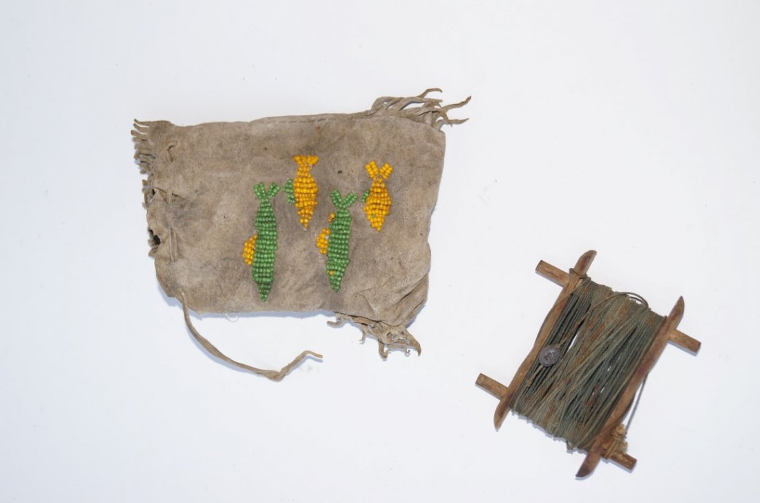Indian Pouch With Fish Bead Work: Indian pouch with a fishing drop line inside. Decorated at the outside with beadwork fish. 5 1/2"h.