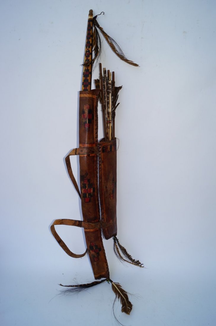 American Indian Bow and Arrow Set: Leather cased. Black and red hand painted decorations on both cases. Name impressed into the back of the leather,W. Parker Lyon. Feather decorated. Eight arrows 44"L.