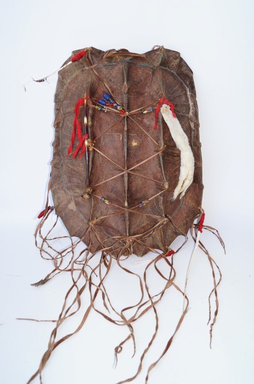 Chippewa Turtle Shell Shield: Large snapping turtle shell shield, used in dances and ceremonials by Chippewa men. Decorated with ermine skin, feathers and antique trade beads.