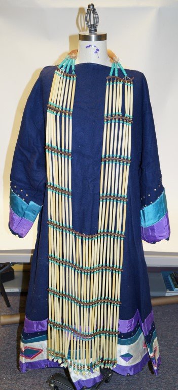 Native American Womans Dress & Beads: Blue wool Native American womans dress with purple, teal and white taffeta decorations. Also sequin and pearl. Abalone buttons. Both hand and machine sewn. Together with a long beaded front piece neck