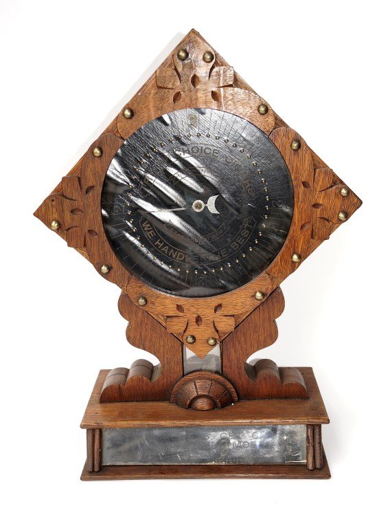 Cigar Store Slot Machine: Carved walnut case. Slot for coin drop. Dial registers one or more cigars. (You always win one sometimes more). 19" high x 11" wide.