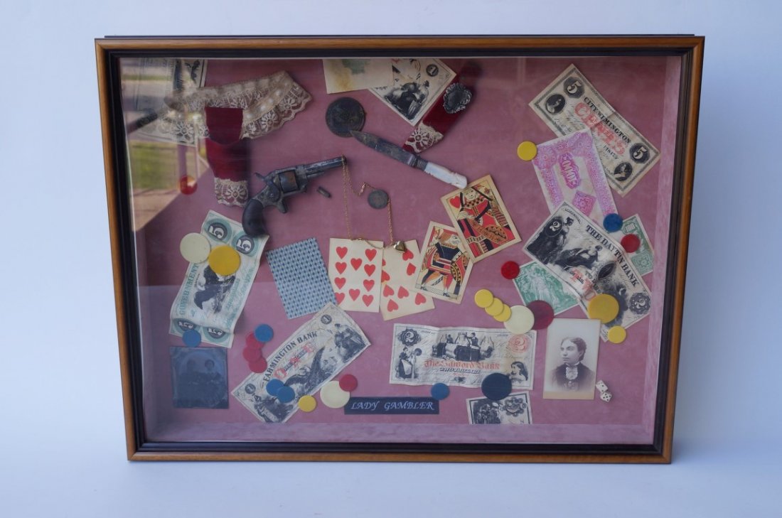 Ladies Gambling Display Box: Contains chips, money, a ladies pistol, a pearl handled knife, a tintype locket, coins and tokens etc. 25" x 19".