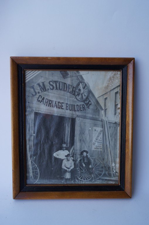 Western Photograph. Studebaker Carriage Builder: Blacksmithing sign at outside of shop. 11 1/2" H. x 9 1/2"W.