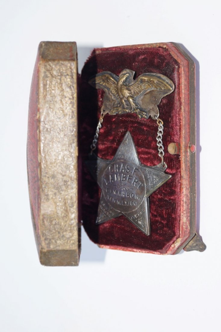 Chas. F. Lambert Badge: Chas.F. Lambert Cimarron New Mexico Star Badge marked with name. Each point of the star is marked, Deputy Game Warden; Constable; Special; Deputy Sheriff and Marshall. Marked at the back Capital Jewel