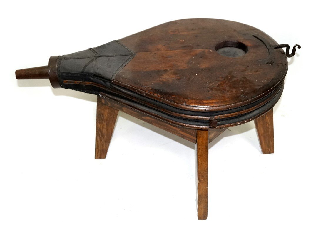 Bellow Coffee Table: Oversized bellows mounted on a four legged base to create a coffee table. 40"L. 27"W. x 21"H.