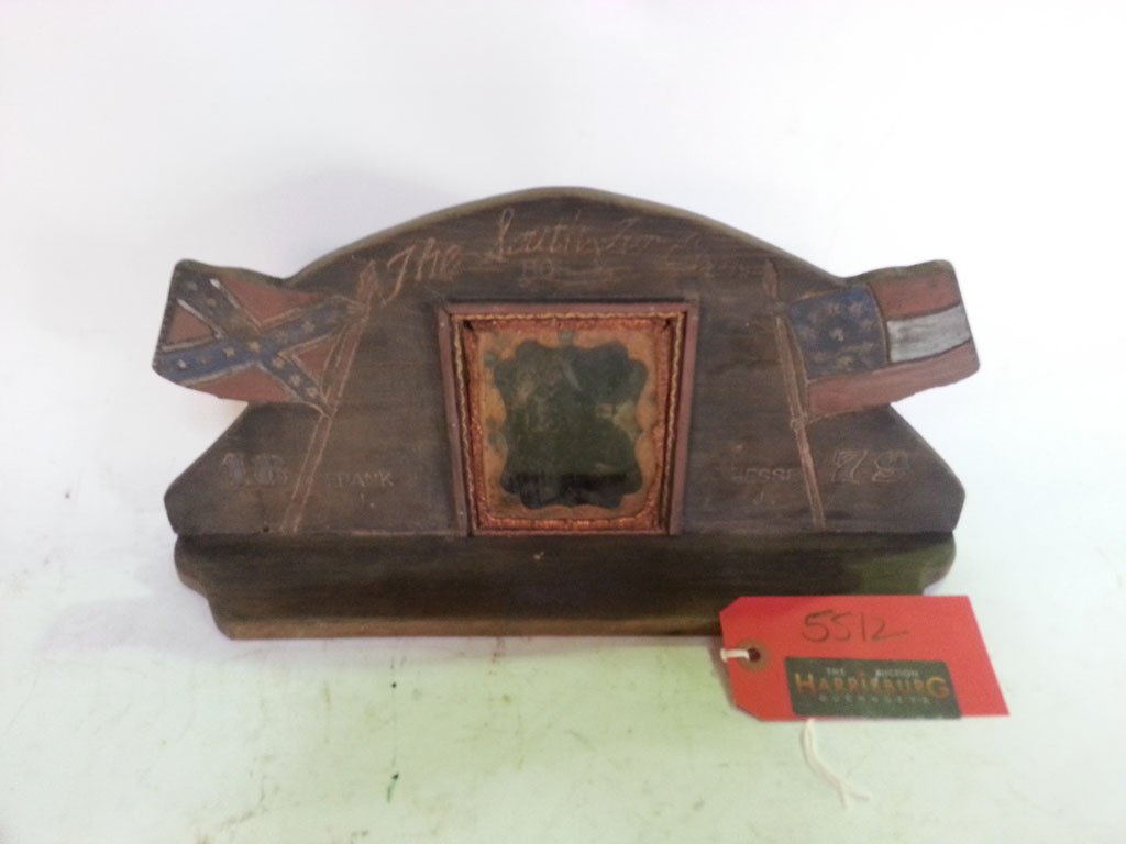 Daguerreotype James Bros.: In a contemporary wood carved framed, with identifications for Jesse and Frank James. Daguerreotype is in deteriorating condition 14" x 8 *"(shelf) 5"H. x 4"W (daguerreotype)