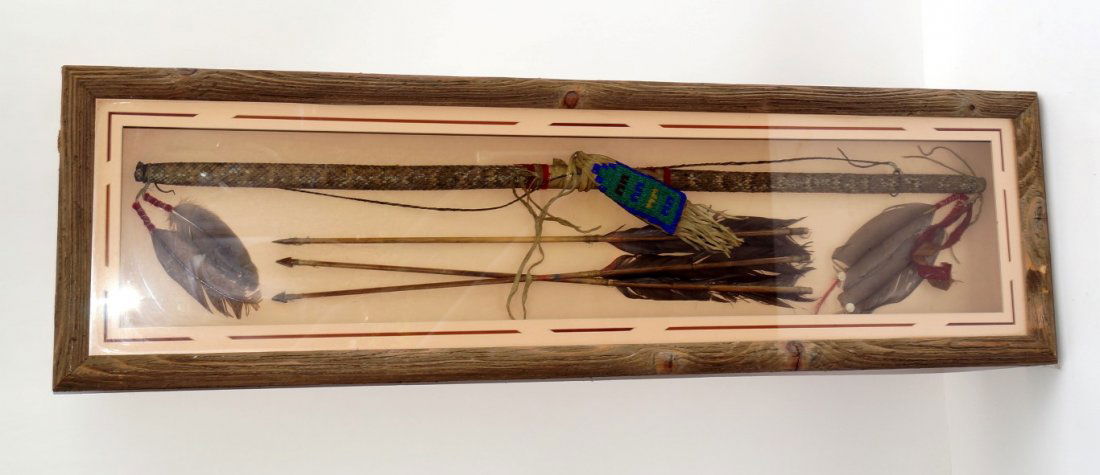 Commanche Indian Bow and Arrows: Commanche Indian Rattlesnake Medicine Bow and Arrows. In a glass topped wooden display case. 49 1/2" x 14"