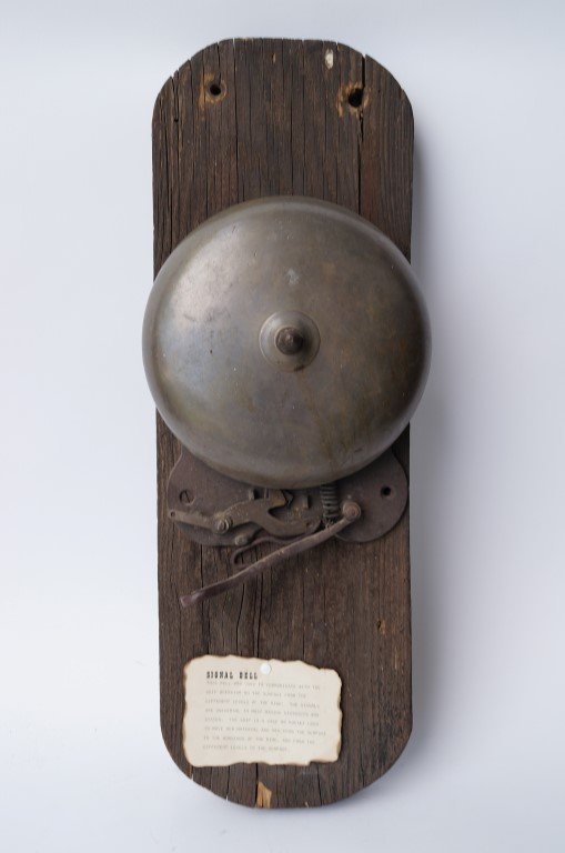 Miner's Signal Bell: Bell was used to communicate with the skip operator on the surfact from the different levels of the mine. The signals were universal in most mining districts. The skip is a cage or a bucket used to mo