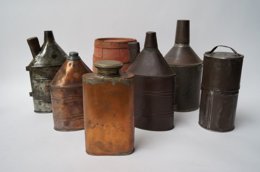 Lot of Miner's Black Powder Flasks & Holders (7): Red painted wooden black powder keg; copper powder flask with narrow top and rope loops; copper powder flask with large filler top; tin powder squib holder with handle; tin powder flask with measuring