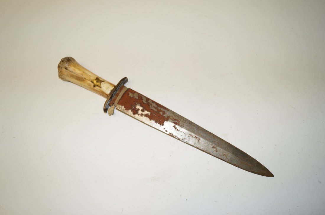 Bone Handled Texas Dagger: Bonehandled Texas Dagger, blade etched "Texas By Gold" Handle is marked JWH" under star. Perhaps the knife of John Wesley Hardin. 13" blade.