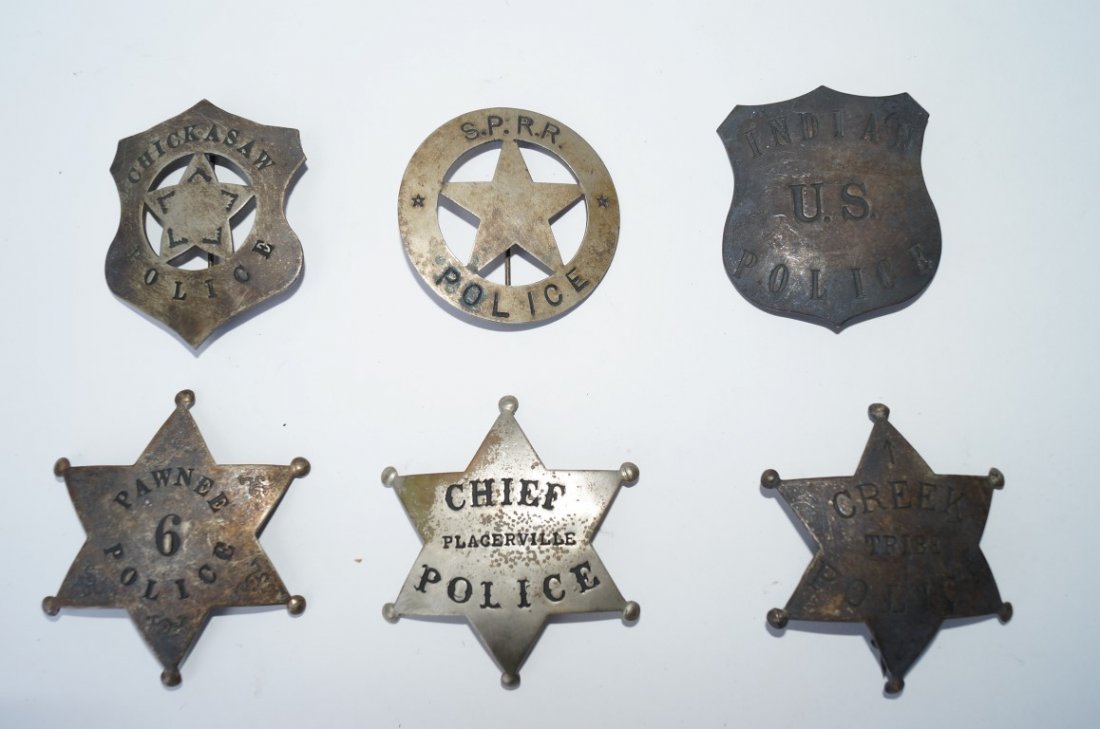 Six Police Badges: Six Police badges to include Creek Tribe Police; S.P.R. R. Police; Plagerville Police; Chickawaw; Indian U.S. Police and Pawnee Varying sizes