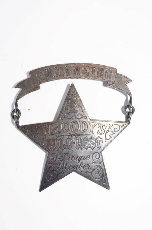 T.H.Rynning W.F. Cody Badge: T. H. Rynning name plaque above a five pointed star marked W.F.Cody's Wild West Troupe Member Ornately engraved.