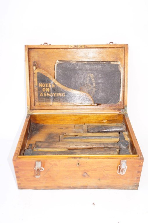 Assaying Chest of R. W. Donaldson: Paint decorations on wood. Inside of chest contains Notes on Assaying book. Varying assaying tools and kits. . 6"H. x 15"W.