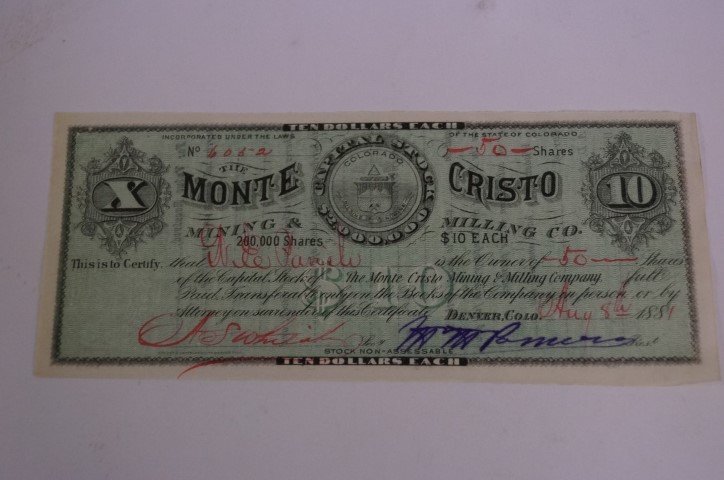 1881 Colorado Mining Stock, Signed: Resembles currency, signed by Mark "Brick" Pomeroy. A biography of Pomeroy is included in the lot. Pomeroy attempted to build the first railroad through the Rocky Mountains. 3.25x7.5".