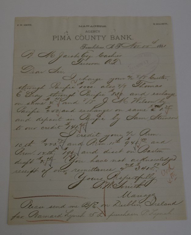 Letter - Pima County Bank - Tombstone, A.T. : Nov. 1881 to L.M. Jacobs, Cashier, Tucson, A.T. charges on account. Signed by P.W. Smith, Manager.