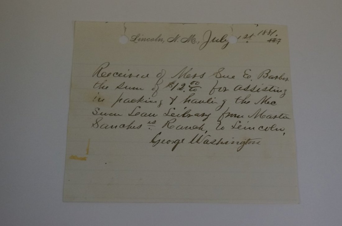 Payment by Mrs. Sue E. Barber: Received of Mrs. Barber July, 1881 - the sum of $12.00 from assisting in packing and hauling the McSween Law Library from Mastin Sanch' Ranch to Lincoln. Signed by George Washington. (George Washingto