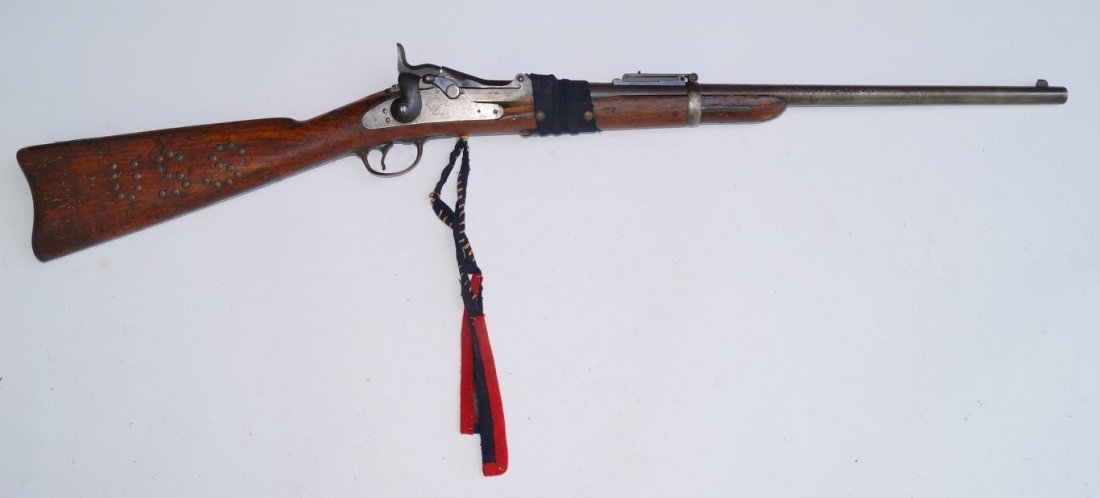 Springfield 1873 Trap Door Saddle Ring Carbine: 45 Govt. calibre U. S. S. markings in brass tacks (Stock cracked, repaired with brass tacks and saddle cloth)