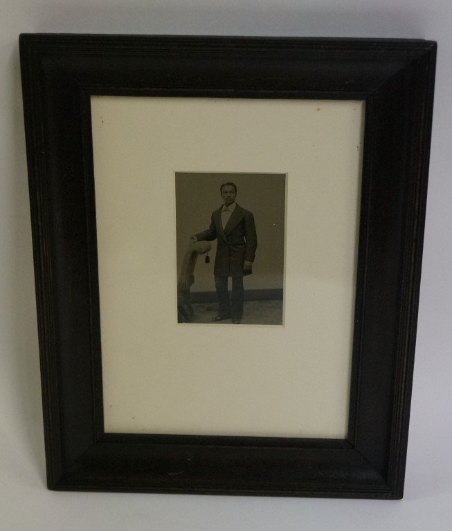 Tintype - African American Tap Dancer: C 1860s-1870s, slightly hand tinted with pink and gold. A rare image because of the dancing shoes. Gallery matted and framed.