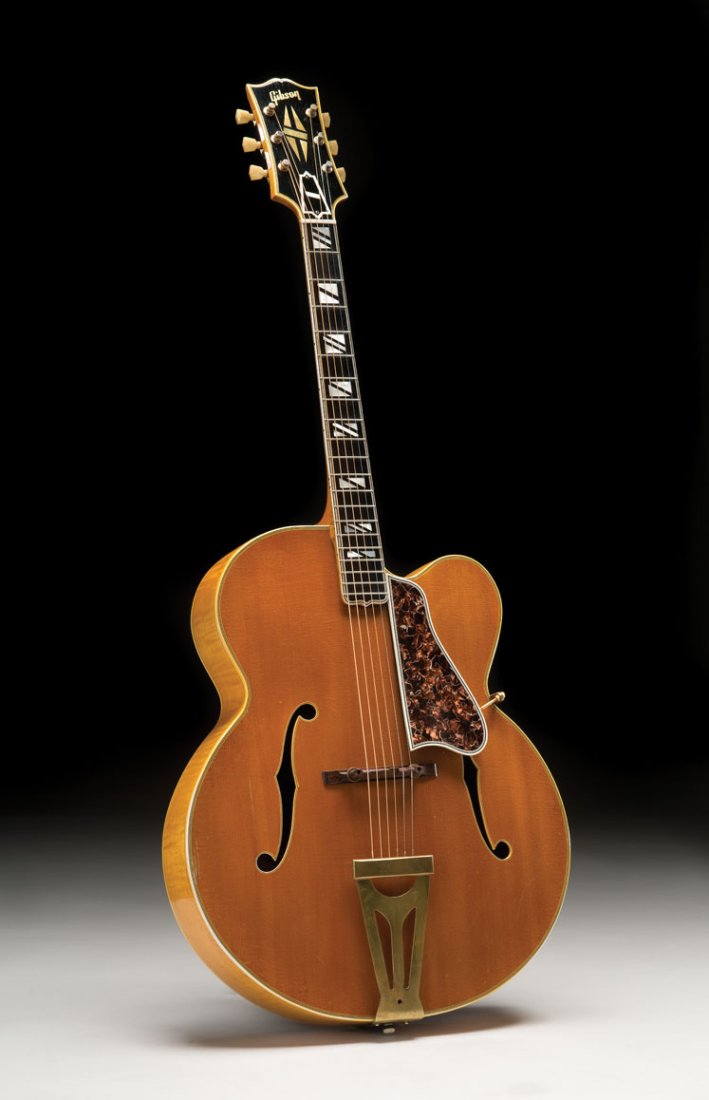 1954 Gibson Super 400CN: By most historical accounts, 1954 was the year that rock and roll music emerged as a definitive style of American music. That was the year that Big Joe Turner recorded “Shake, Rattle and Roll”, Bi