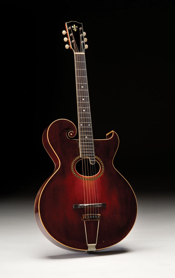 1917 Gibson Style O: NO RESERVE. This 1917 Style O has the common sunburst finish, but its individual tuners are an exception to the three-on-a-plate tuners usually installed on this model