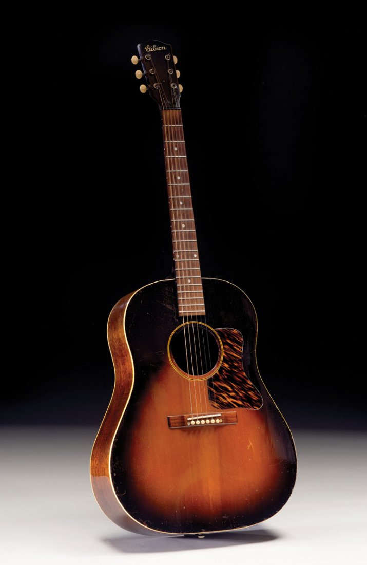 1941 Gibson J-35: The neck block on this Gibson jumbo flattop is very clearly stamped with the unusual number 4660 G on its neck block, which does not conform to either the FON or serial numbers of its era. Judging fro
