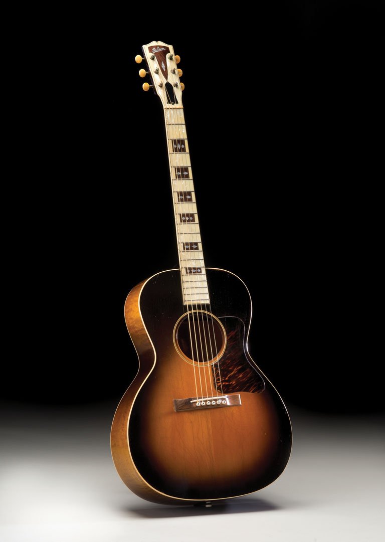 C. Mid-1930's Gibson L-C: NO RESERVE. This mid-’30s L-C is almost identical to the other example in this auction, but instead it features a black plastic truss rod cover instead of the 1933 exa