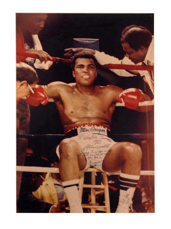 Muhammad Ali in His Corner by Neil Anton, 1981: Muhammad Ali photographed in his corner by Neil Anton. “Drama in the Bahamas,” December 11, 1981. Ali defeated Trevor Berbick. Inscribed in the following manner: "To Waylon Jennings. Love from Moh