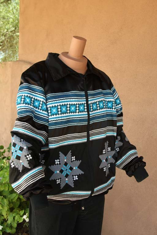 Black and blue satin jacket with Native American Motif: Black and blue satin jacket with Native American motif and red lining. Gift from Navajo or Sioux.