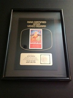 RIAA Certified Gold Video Award: RIAA Certified Gold Video Award presented to Waylon Jennings for his performance in the theatrical video movie Follow That Bird. Two-dimensional. Framed, 17" x 13".