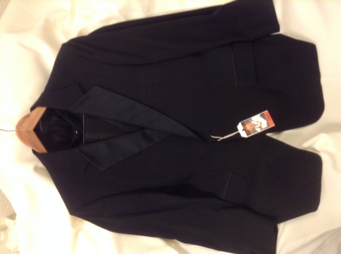 Waylon Jennings' Three Piece Tuxedo: Jacket, vest and pants. With label for Atilla's of Brentwood.