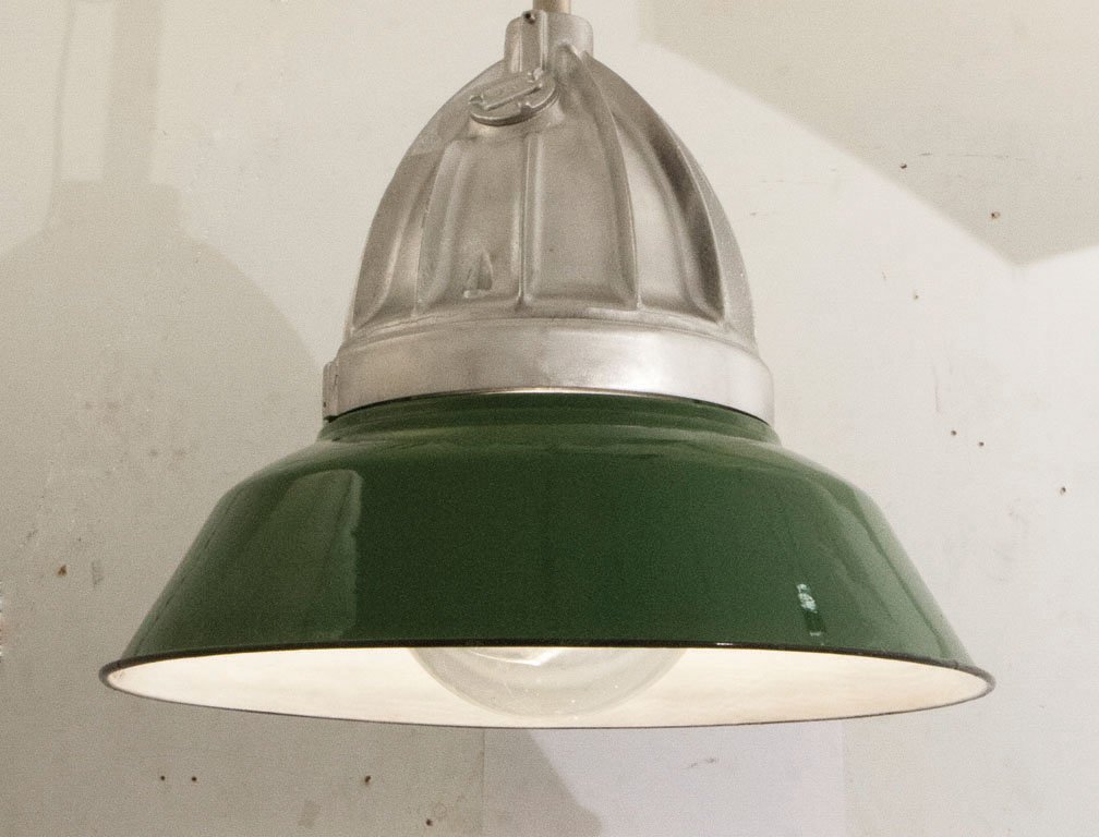 (2) INDUSTRIAL LAMP WITH RIBBED PENDANT, C. 1940: These restored lamp fixtures feature original green enamel shades held by Crouse-Hinds pendants. Each light is suspended on a chain. H 22.5" x Dia. 20" TWO (2) LIGHTS PER LOT