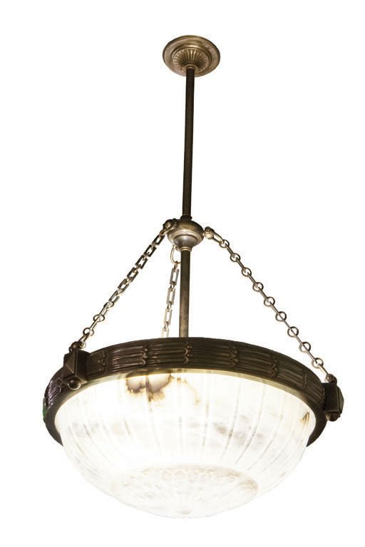 CARVED ALABASTER AND BRASS HANGING LIGHT, C. 1930: Featuring a large carved alabaster dome and brass hardware, this hanging light is an example of the use of exotic materials in the Art Deco movement. The brass base of the dome is decorated with a hor