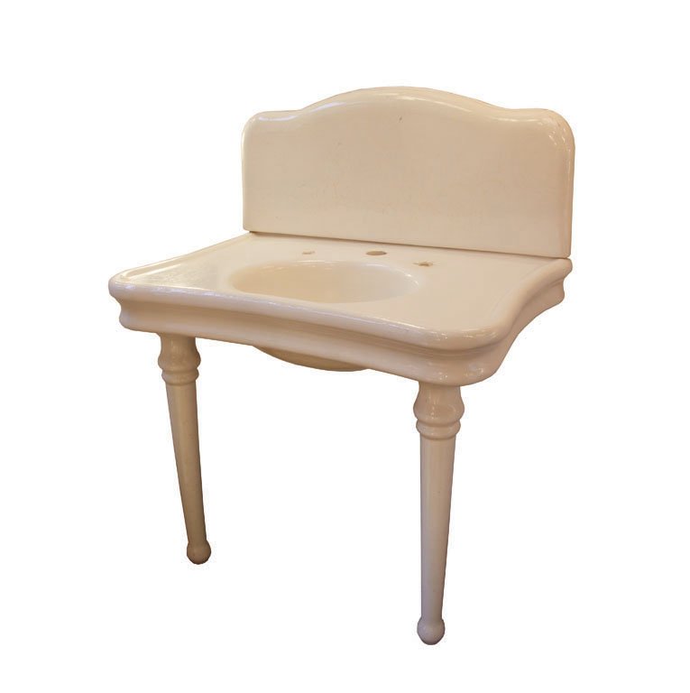 VINTAGE PORCELAIN SINK C. 1900: This porcelain sink was salvaged from a New York apartment buidling. H 46" x W 36" D 24"