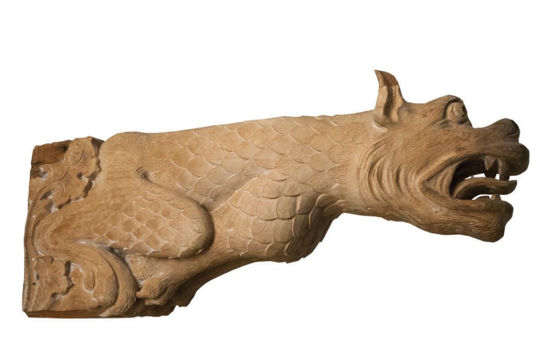 ONE PAIR OF WOOD-CARVED GRIFFINS C. 1890: Expertly hand-carved by an Amish craftsman in Lancaster, Pennsylvania, both griffins are in excellent condition. Each features fine detailing in the handling of the face and taloned feet. The griffin 