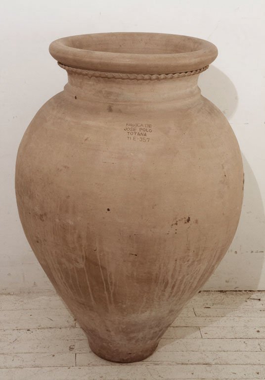 OLIVE JAR, C. 1950: Made of terracotta, this jar bears the insciption "FABRICA DE/ JOSE POLO/ TOTANA/ TI E-357". It was one of many used to ship olives from perhaps Greece or Spain to America in the mid-20th century. H 3