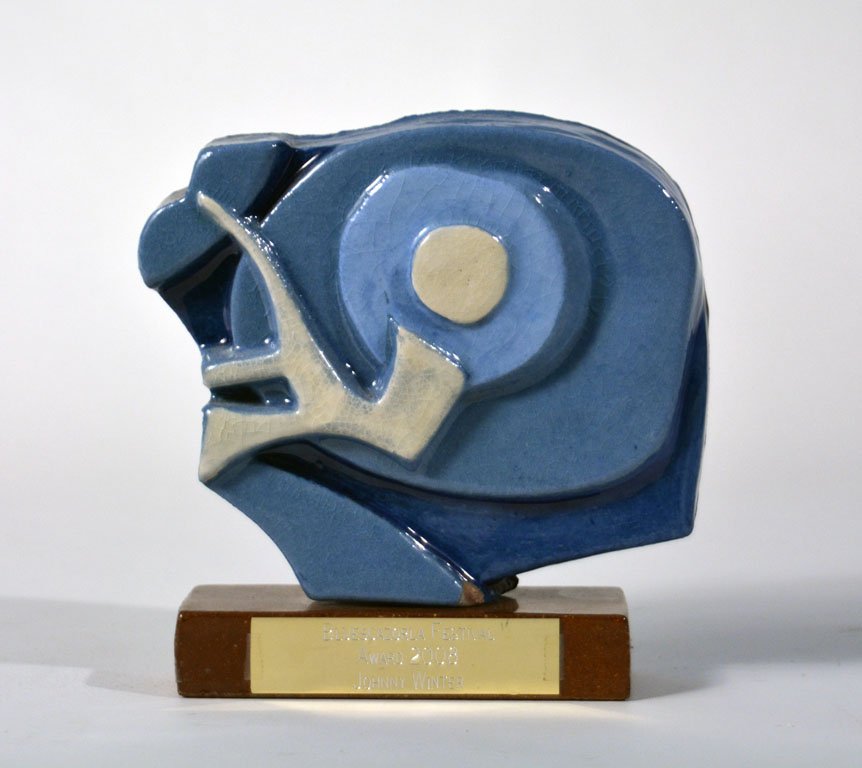 BluesCazorla Festival Award 2008: Awarded in 2008 to Johnny Winter at the BluesCazorla Festival. The BluesCazorla Festival has been held annually since 1994 in Cazorla, Spain. Approx. 7.5". Ceramic.