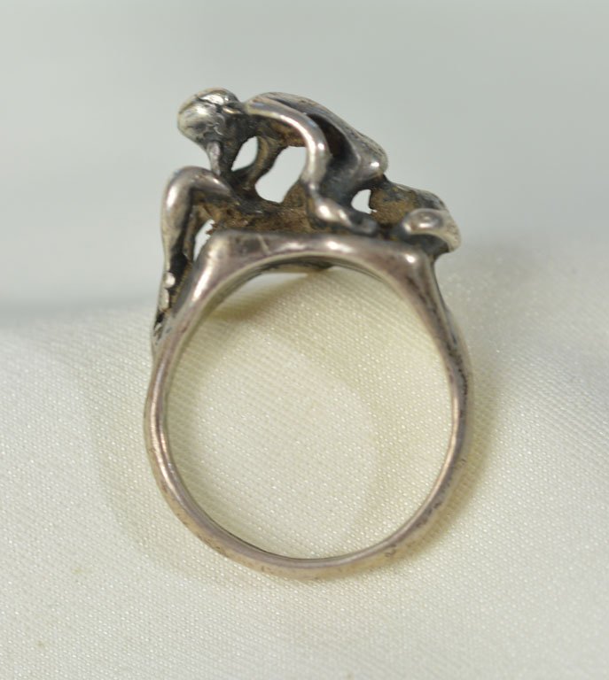 Johnny Winter's Erotic Silver Ring: Silver ring, reminiscent of the lyrics of Johnny's "I Love Everybody": "I ain't tired, no, I ain't hungry / But I'm horny as I can be / Been a long time comin' baby / Better come get some of me."