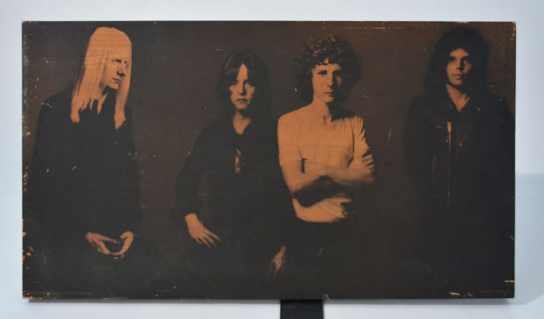 Sepia Band Photo Wooden Art Block: Moody sepia photograph of Johnny Winter and band members rinted onto a block of wood for hanging or display. Some paper loss around the edges. Photographed by Norman Seeff. The wooden art blocks being