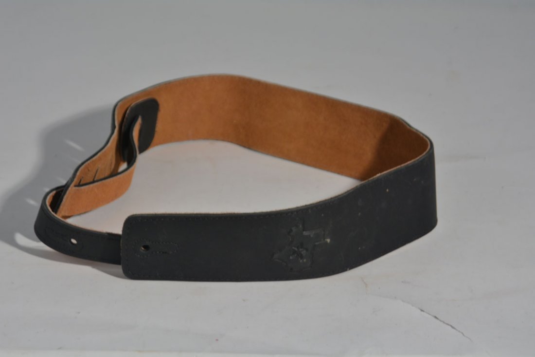 Two of Johnny Winter's Guitar Straps: Snakeskin and (1 of 4)