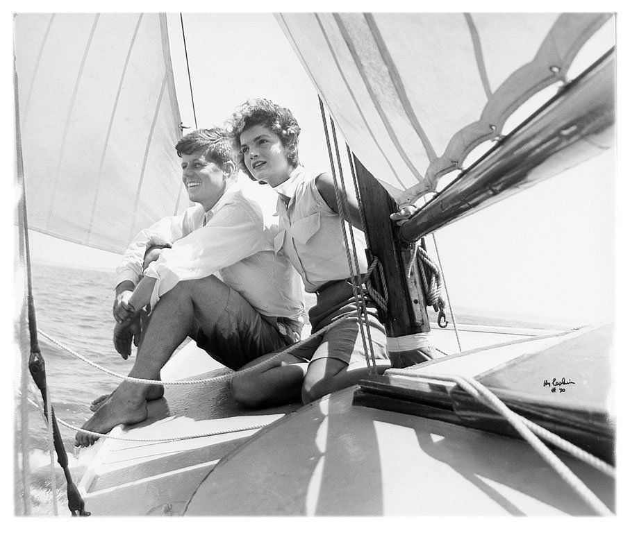 Hy Peskin (1915-2005): Note: Description Updated 11/22. Sen. John Kennedy & Jacqueline Bouvier. B&W, 1953. Fiber-based gelatin silver. Older print. Full bleed. Then-Senator John F. Kennedy and Jacqueline Bouvier, sailing of