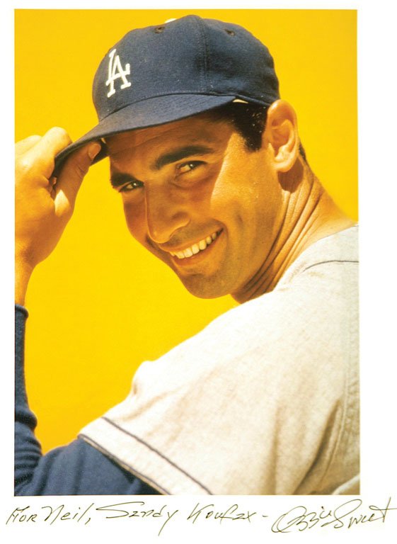 Ozzie Sweet (1918-2013): Note: Description Updated 11/22. Sandy Koufax. Color, 1961. Type "C" older print. Signed, titled, and inscribed in ink to Neil Leifer by photographer. 11 x 14in. The photographs in this auction have b