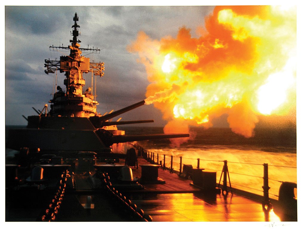 Battleship New Jersey: Color, 1968. Guns blazing in the Gulf of Tonkin, North Vietnam, October 1968. Featured in book The Best of Leifer. Signed in ink by Neil Leifer. 24 x 20in. The photographs in this auction have been ex