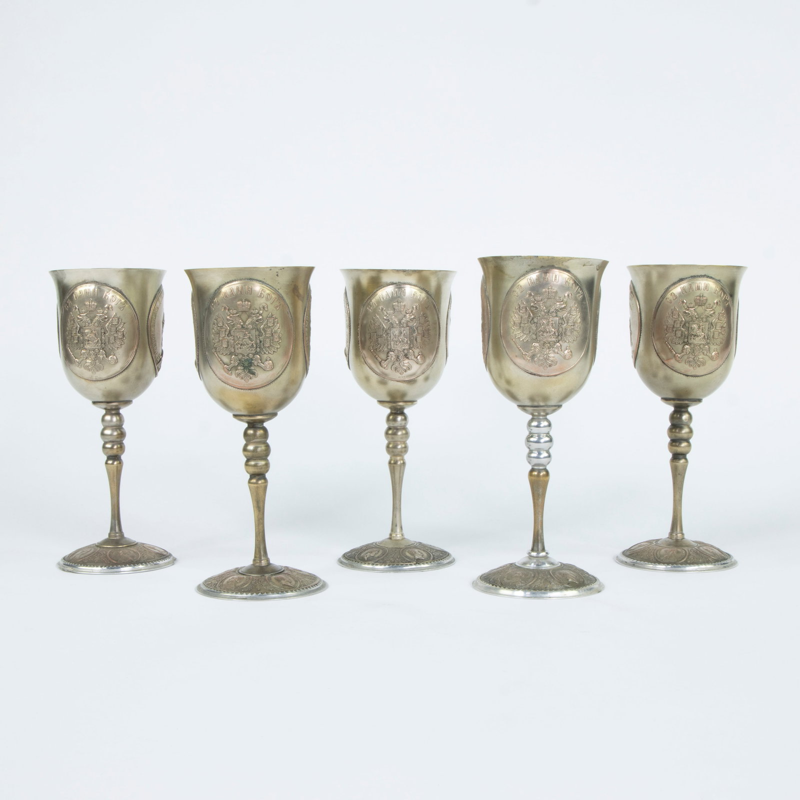 Decorative set of metal chalices, each richly decorated with double-sided medallions: on the chalice (1 of 6)