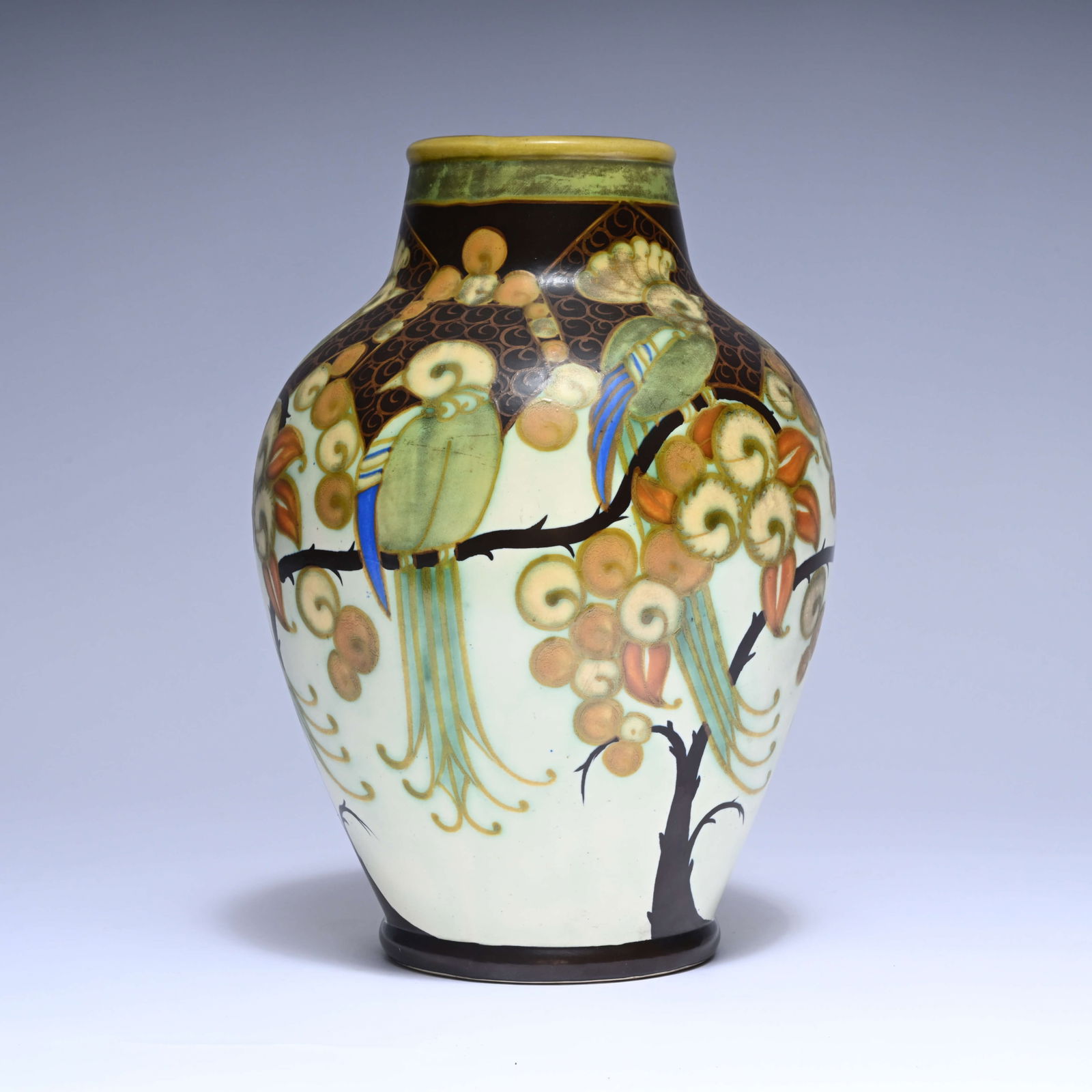 Charles CATTEAU (1880-1966), Boch Keramis Art Deco vase with decoration of branches and parrots,: Charles CATTEAU (1880-1966), Boch Keramis Art Deco vase with decoration of branches and parrots, marked and D 1130Charles CATTEAU (1880-1966), Boch Keramis Art Deco vaas met decor van takken en papega