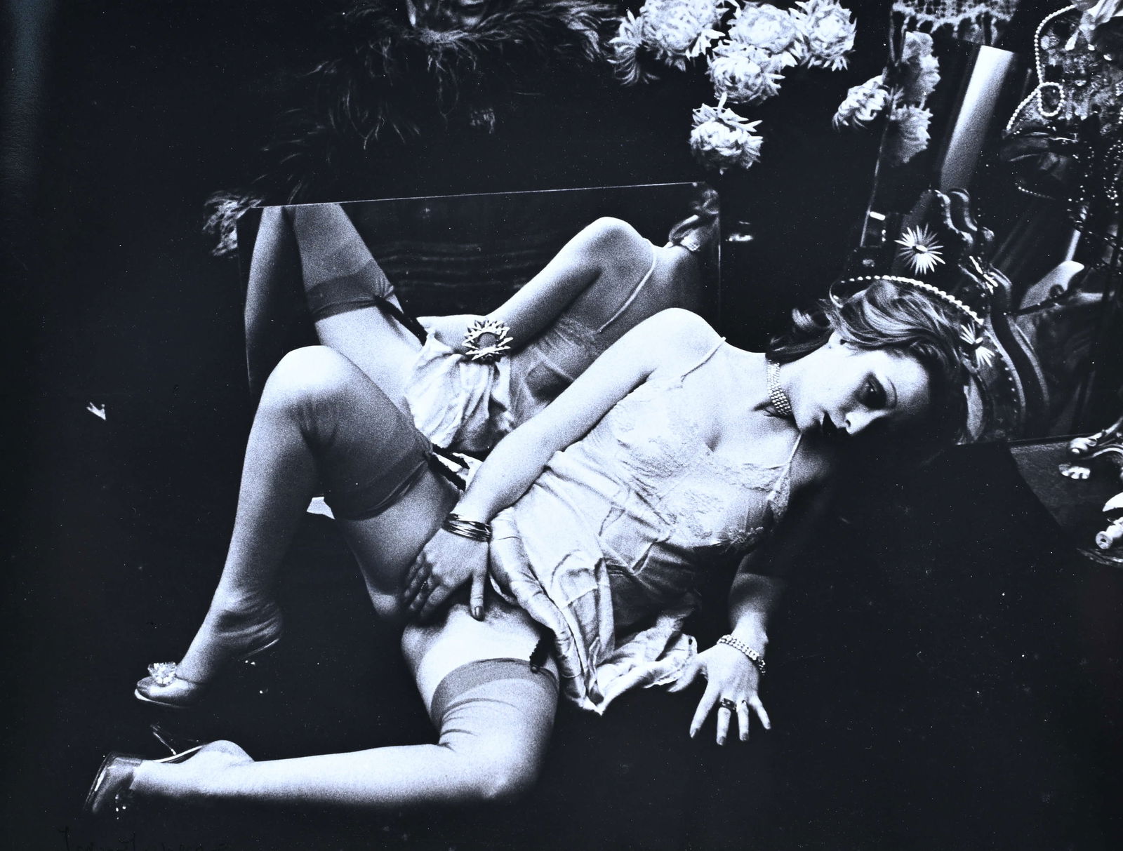 Irina IONESCO (1930-2022), Gelatin silver print, Woman in lingerie, surrounded by flowers. Signed: Irina IONESCO (1930-2022), Gelatin silver print, Woman in lingerie, surrounded by flowers. Signed lower left. From the series 'Erotique voilee' (1970s)Irina IONESCO (1930-2022), Gelatine zilver print,