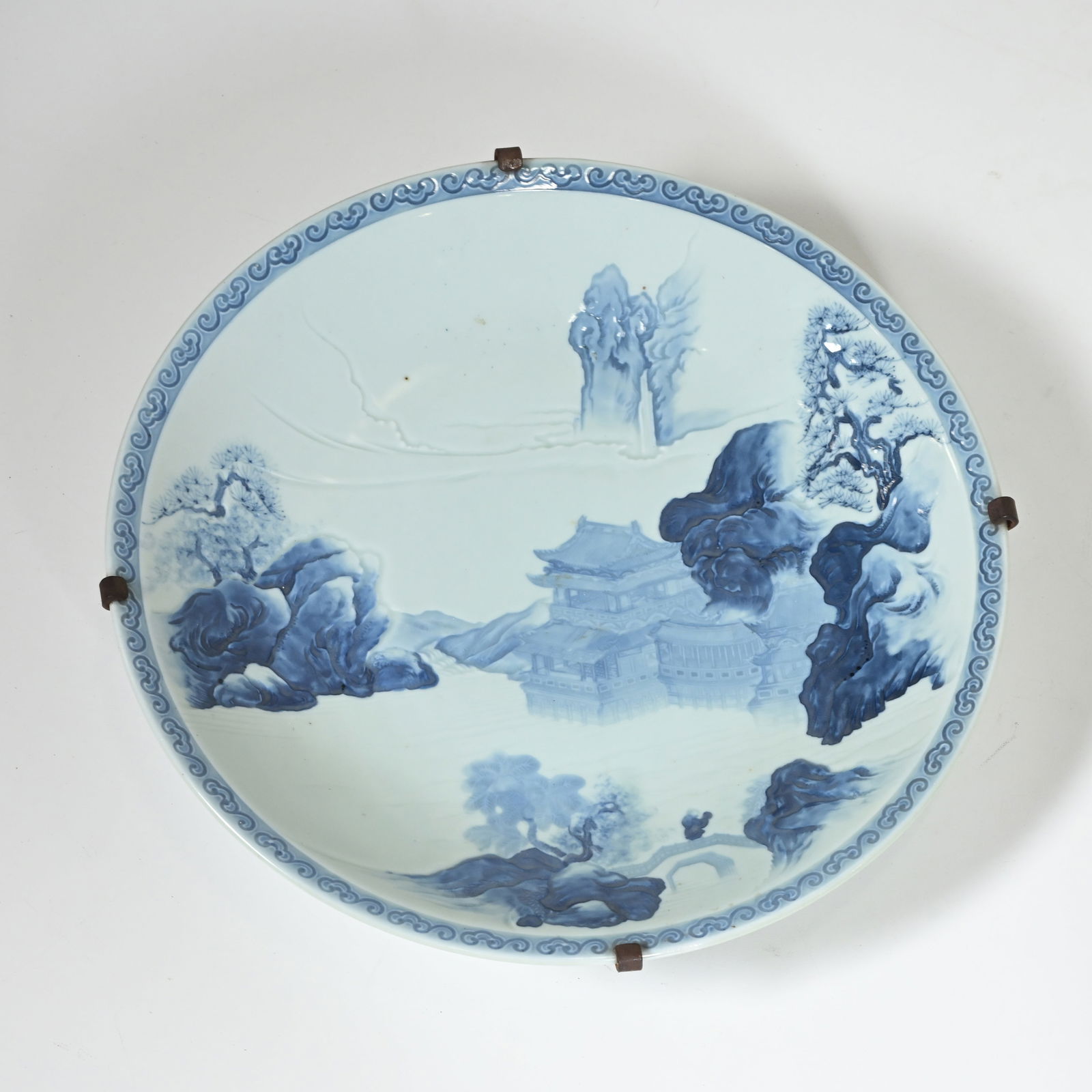 Large Chinese celadon dish in blue and white with a landscape and temple decoration (1 of 4)